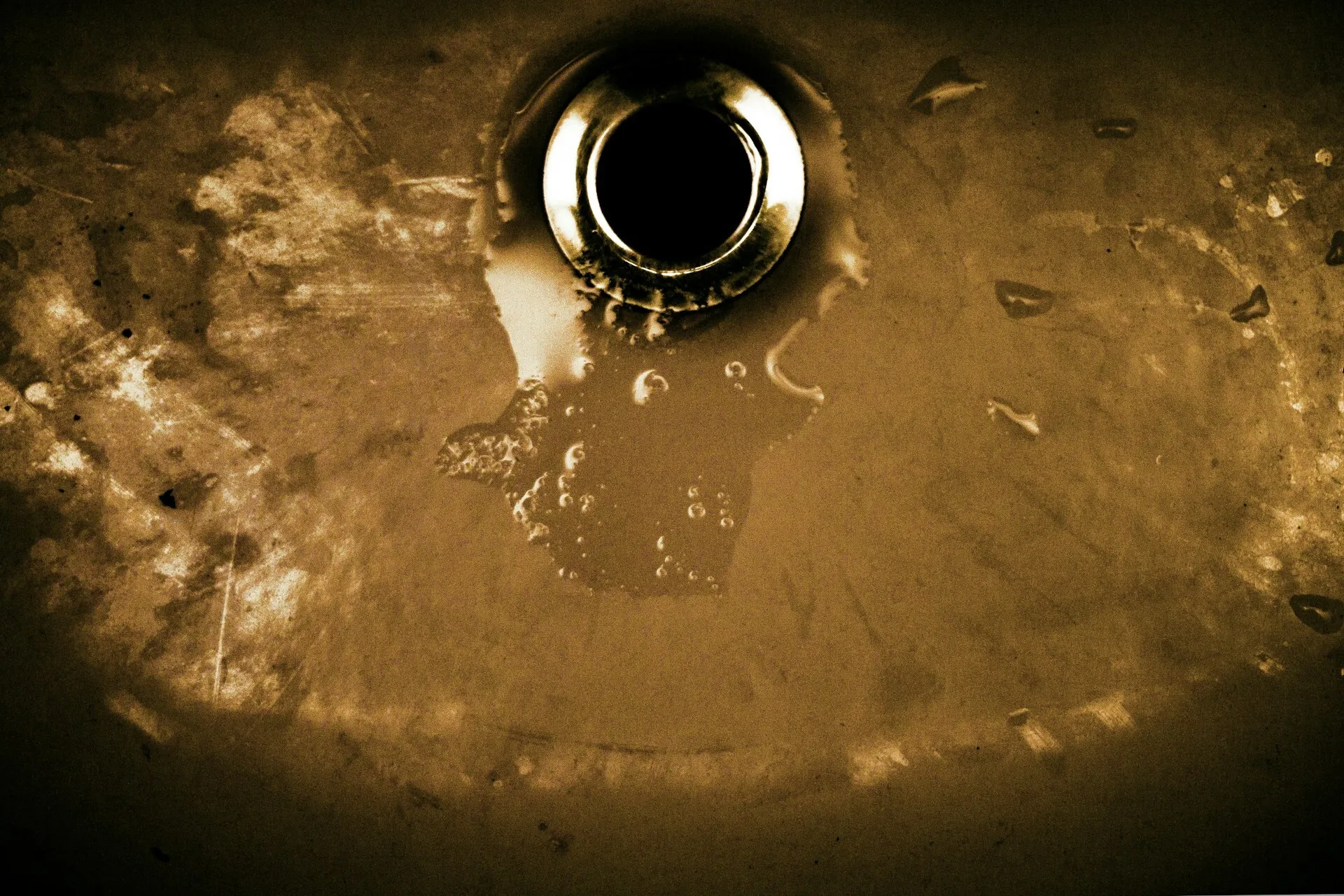 Water draining into a sink drain